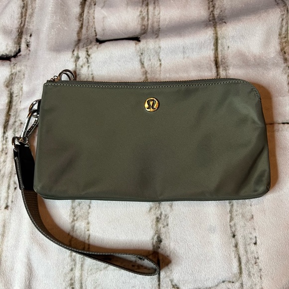 lululemon athletica Handbags - NWOT Lululemon curved wristlet sage grey color